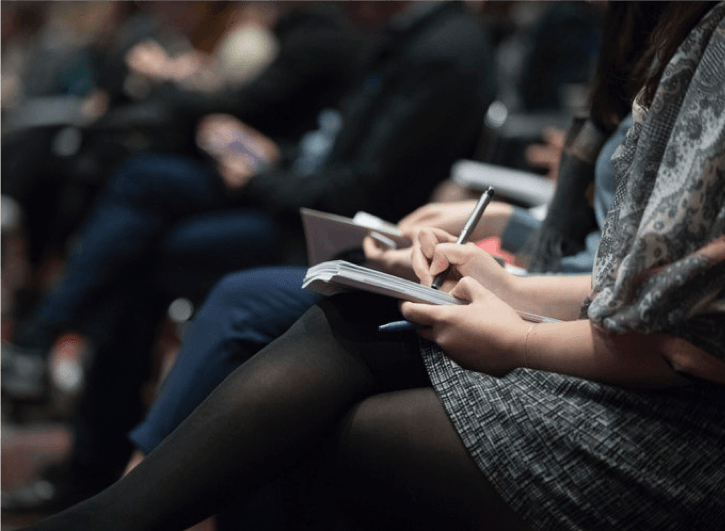 taking notes during an employee benefits meeting